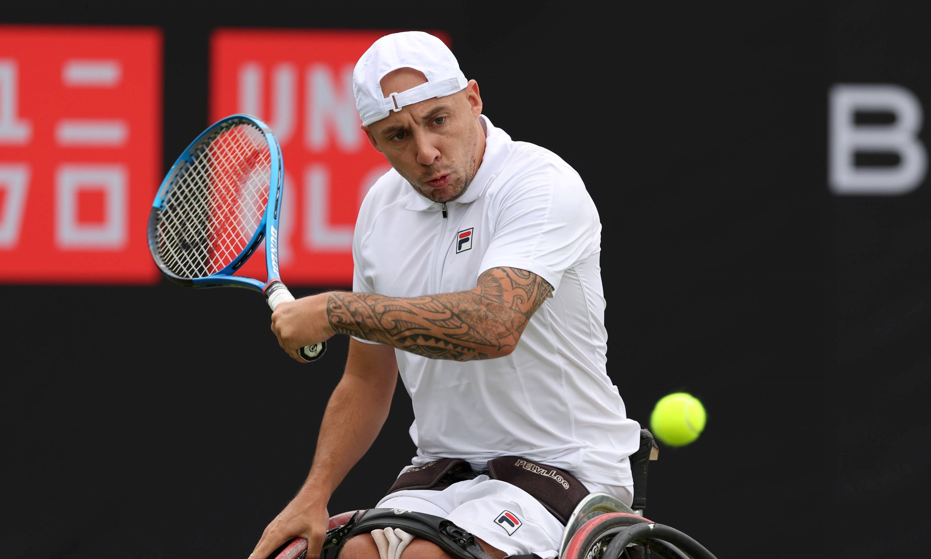 Quad tennis player Andy Lapthorne preparing to hit a backhand on court during a match on the UNIQLO Wheelchair Tennis Tour