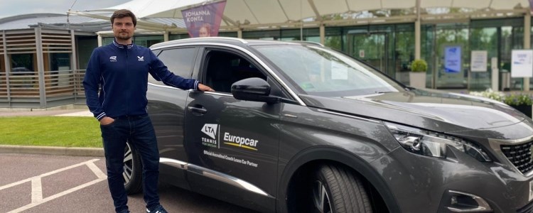 Merlin van de Braam with a Europcar outside of the NTC