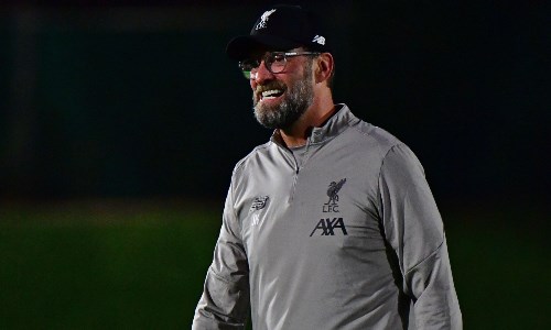 Jurgen Klopp smiling in his Liverpool uniform