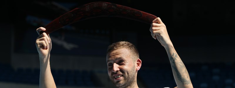 Dan Evans holds a boomerang in the air after winning Murray River Open