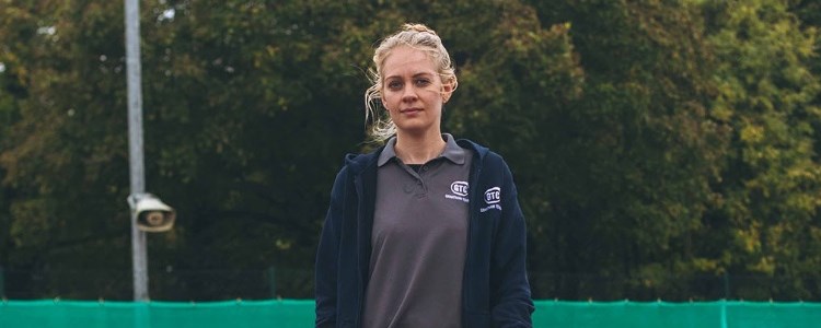 Becky Davies on a tennis court