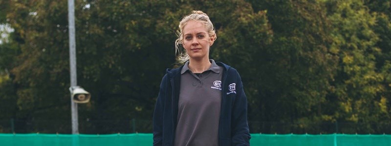 Becky Davies on a tennis court