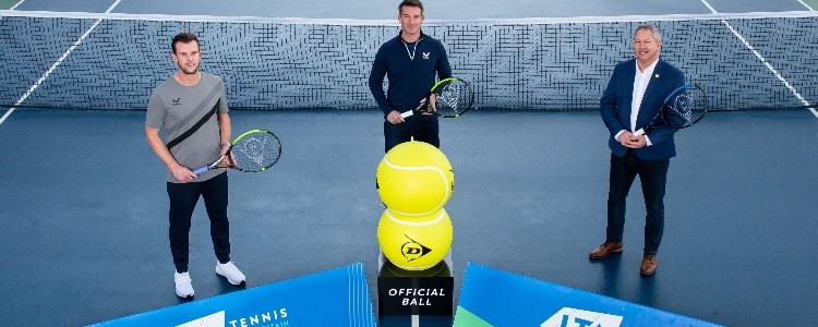 Leon Smith, Scott Lloyd and Steve Heatley holding tennis rackets on a court