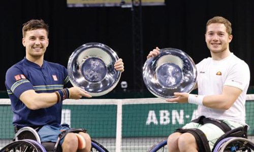 Alfie Hewett and Gordon Reid with their trophy in Rotterdam