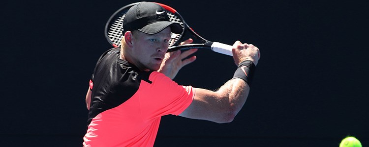 Kyle Edmund playing a backhand shot at the 2018 Australian Open