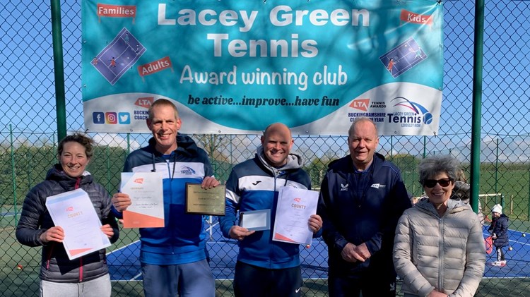 A team of five staff at Lacey Gen and Loosely Row Tennis Club, stood holding certificates 