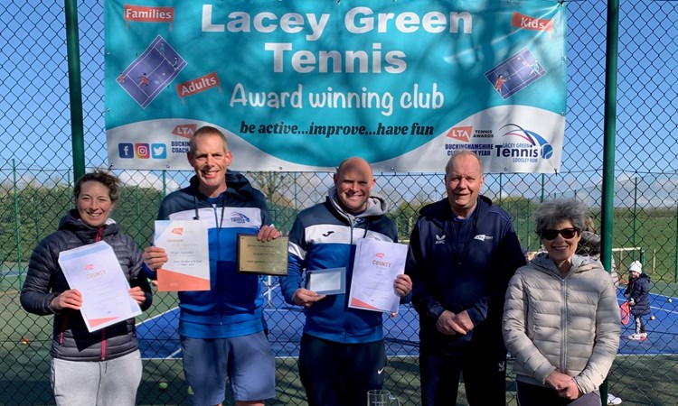 A team of five staff at Lacey Gen and Loosely Row Tennis Club, stood holding certificates 