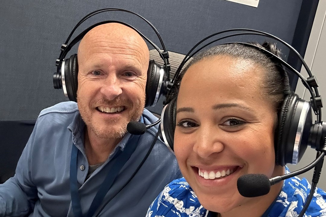 Yasmin Clarke in the broadcasting booth with Paul Hand