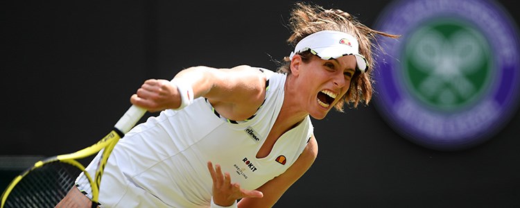 Johanna Konta serving a tennis shot at Wimbledon