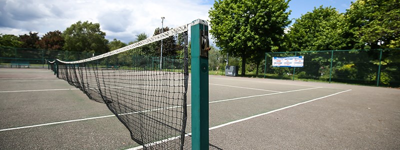 Tennis court net at a local park