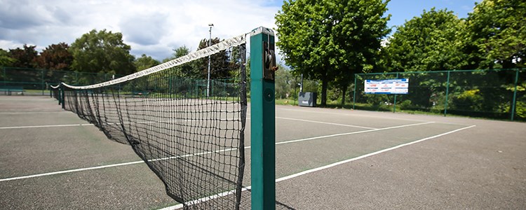 Tennis court net at a local park