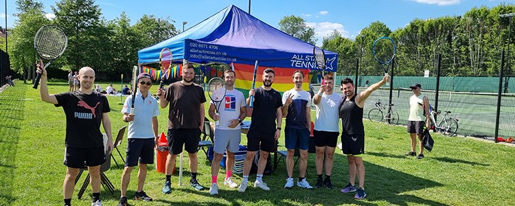 team of south london smashers standing in front of all stars tennis tent outside tennis courts