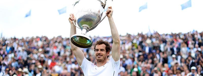 Andy Murray lifting a trophy after winning the men's final at Queens in 2016