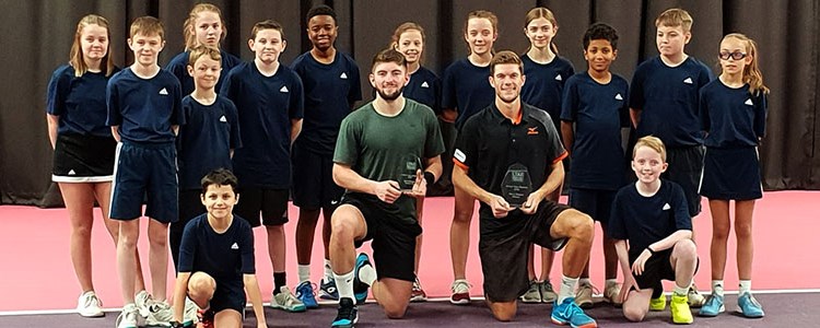 Neil Pauffley and Sean Hodkin with their awards and a group of young boys and girls