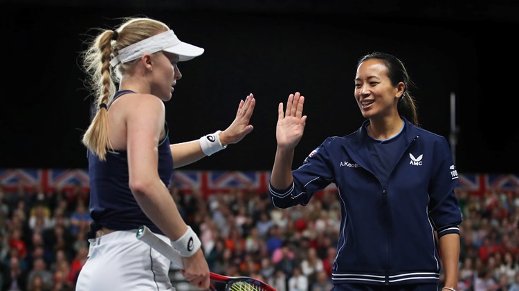 Harriet Dart dressed in her Great Britain Billie Jean King Cup kit high-fiving Anne Keothavong on court during a previous tie