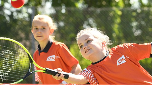 A child hitting a tennis ball as part of the Youth Start programme