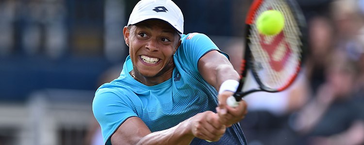Jay Clarke playing a two-handed backhand