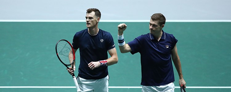 Jamie Murray and Neal Skupski celebrate winning a point on court