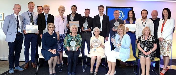 Group of people smiling with their awards