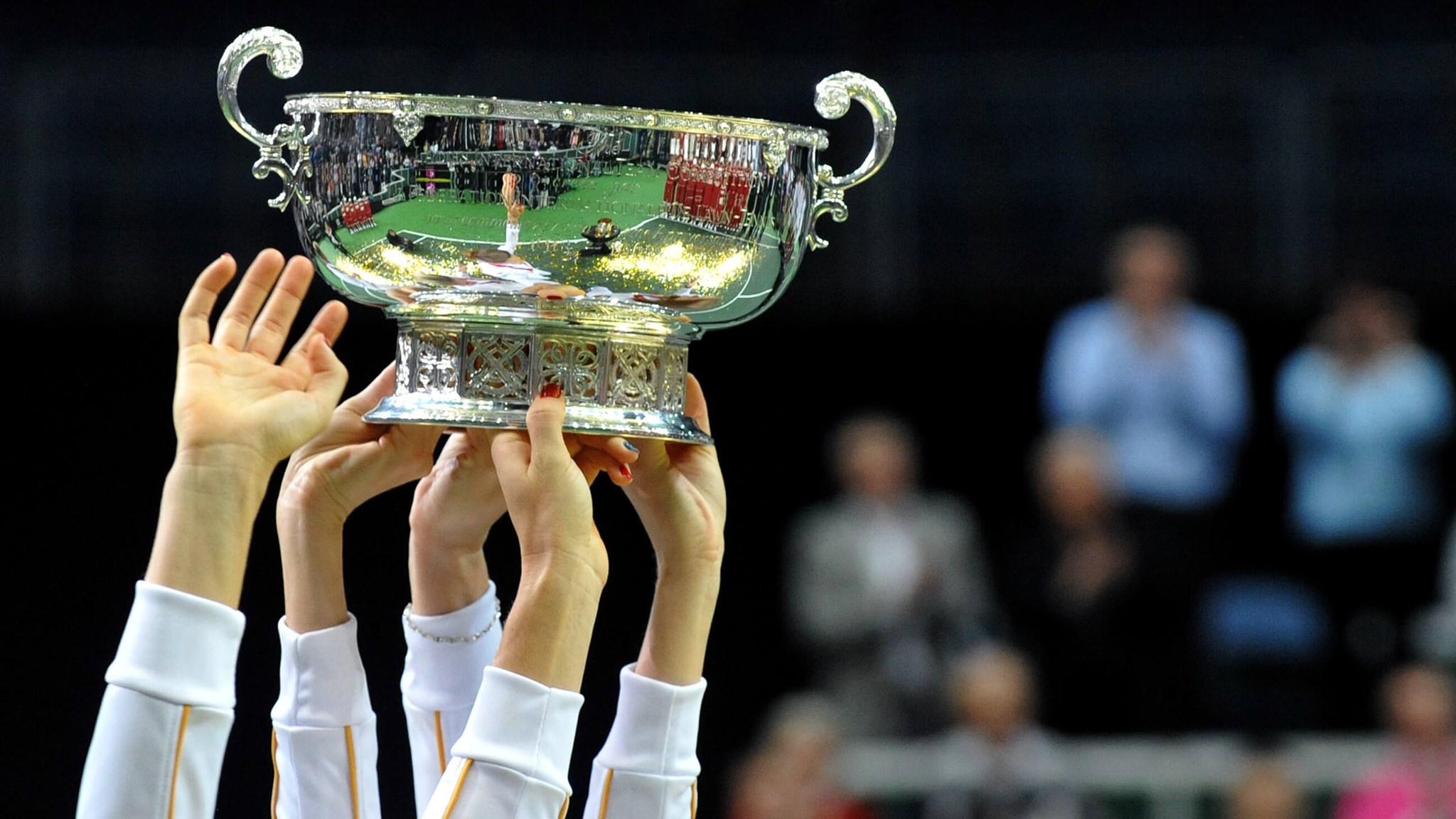 Members of the Czech Fed Cup Tennis team hold the trophy of the International Tennis Federation Fed Cup on November 4, 2012, in Prague.