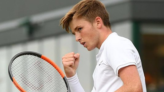 Aiden McHugh celebrating a win at Wimbledon