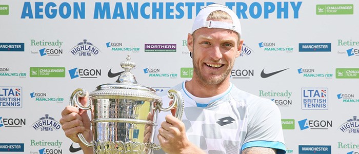 Sam Groth smiling with his Aegon Manchester trophy