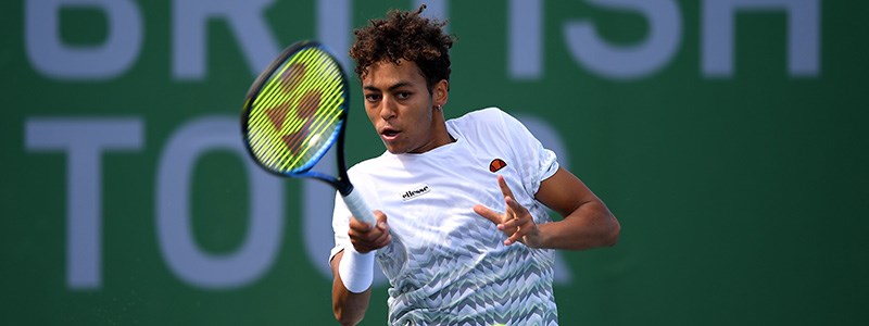 Paul Jubb playing a tennis match at British Tour