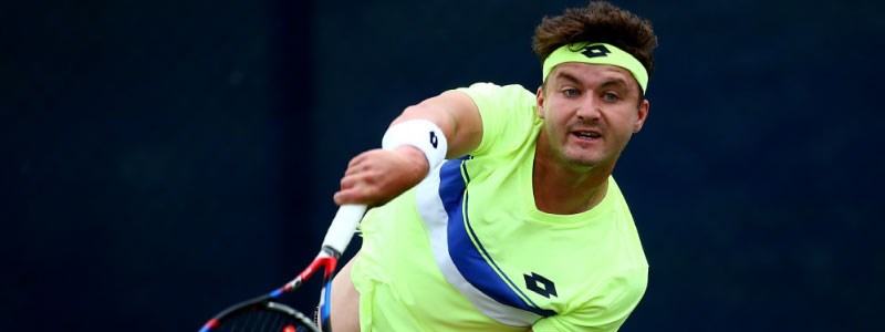 close up image of jonny o mara serving a ball