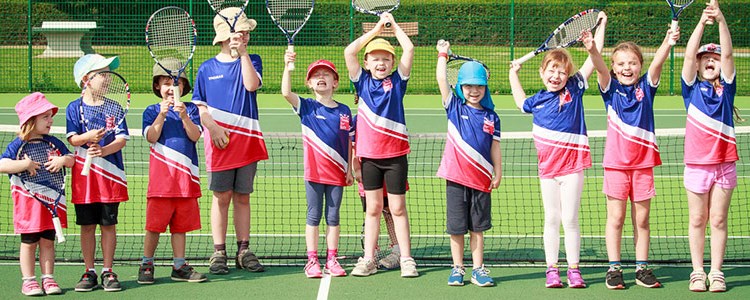 Group of boys and girls cheering for tennis