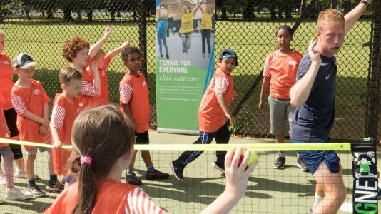 Tennis coaching session with young boys and girls run by Rob Gaunt