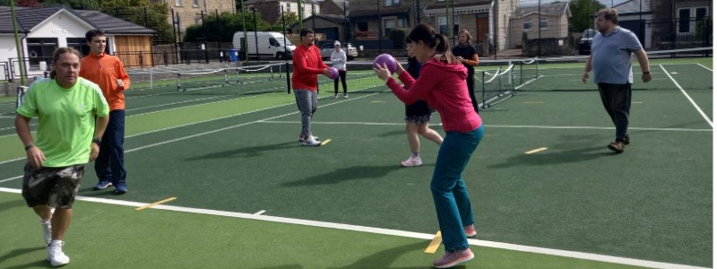 players training  on court for Level 1  coaching assistant coach at Lanark tennis club