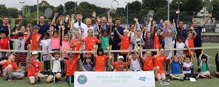 Adults and children celebrating the first ‘Middle Sunday Opened Up’ free tennis festival