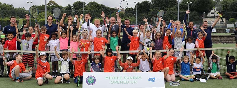 Adults and children celebrating the first ‘Middle Sunday Opened Up’ free tennis festival