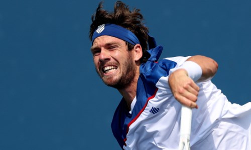 Cam Norrie serving