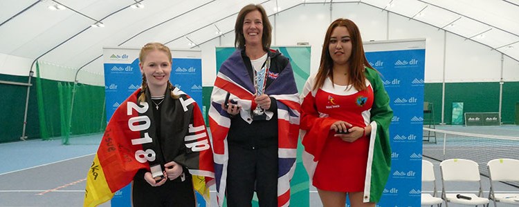 Tennis players on the podium at the International Blind Tennis tournament in 2019