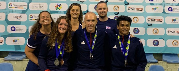 Great British players smiling at the 2019 world deaf tennis championships with medals round neck