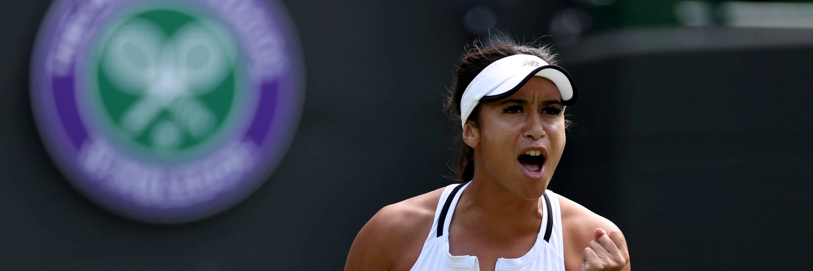 Heather Watson clenching her fist while shouting on court at Wimbledon