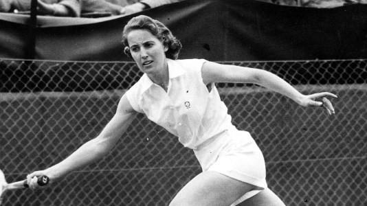 Angela Mortimer reaches for a forehand