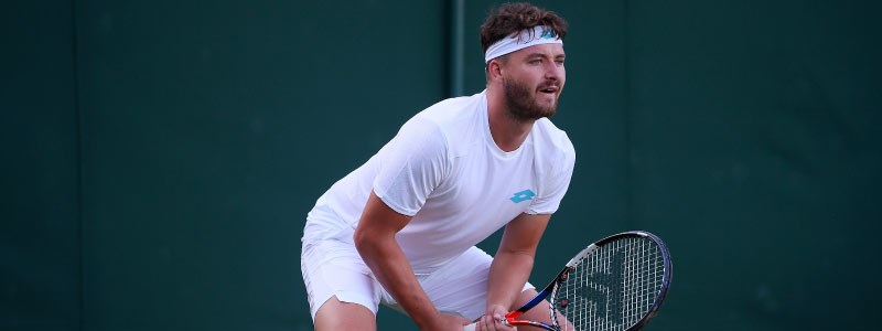 jonny o mara on court playing a match getting ready to hit a shot