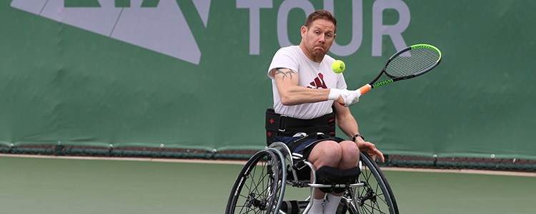 antony cotterill about to hit a ball coming towards him at lta torunamet