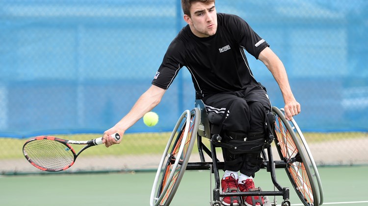 James Shaw hits a forehand