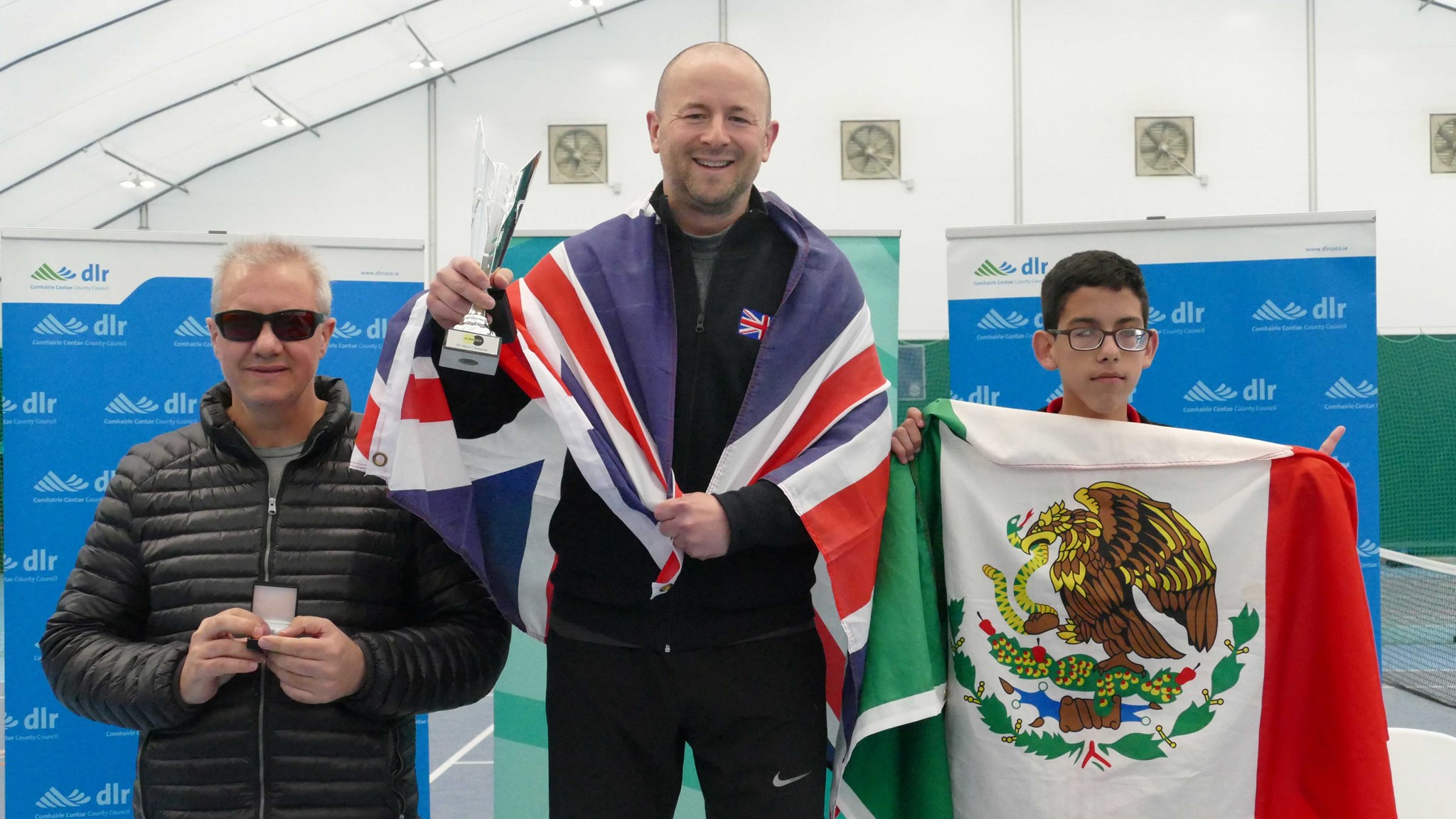 Paul Ryb posing with award