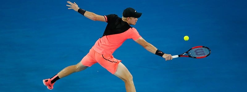 Edmund performing a backhand at the Australian open in 2018
