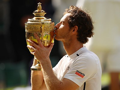 Andy Murray kissing his trophy after winning Wimbledon in 2016