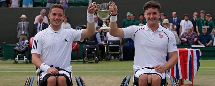 Alfie Hewett and Gordon Reid both smiling and holding a trophy
