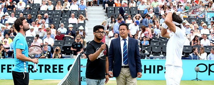 Feliciano Lopez and Giles Simon with StreetGames performing a coin toss at the 2019 Queen's Championships