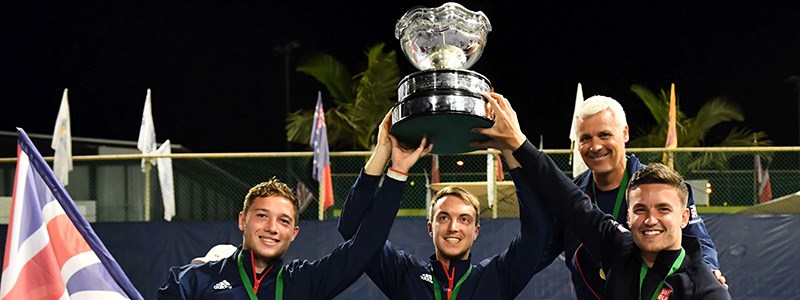 Great Britain's men's wheelchair tennis team hold their trophy in the air at the BNP Paribas world team cup in 2019