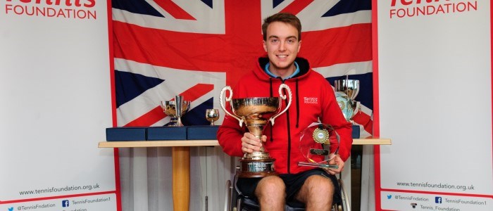 Dermot Bailey holds the Men's Singles National trophy