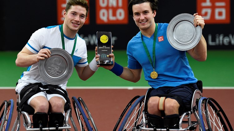 Alfie Hewett and Gordon Reid pose with their Doubles Masters trophies in 2017