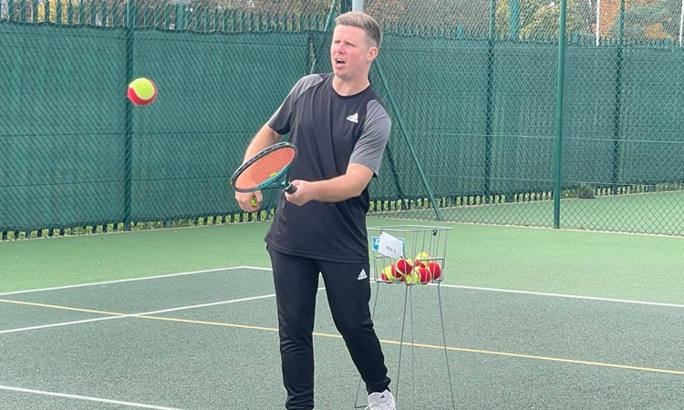 Tennis Coach James Ward leading a lesson
